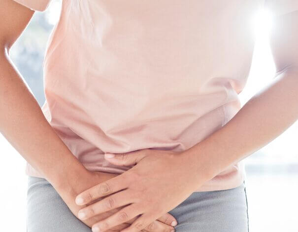 Person putting his hands on his crotch as he needs to urinate
